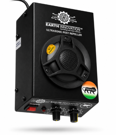 Ultrasonic pest repeller device with control knobs and power switch on a black metal box labeled 'Earth Innovation' and 'Made in India' sticker nearby