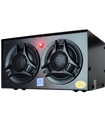 Black speaker cabinet with two large round drivers and a red indicator light on the front panel; QC Passed sticker visible at bottom corner.